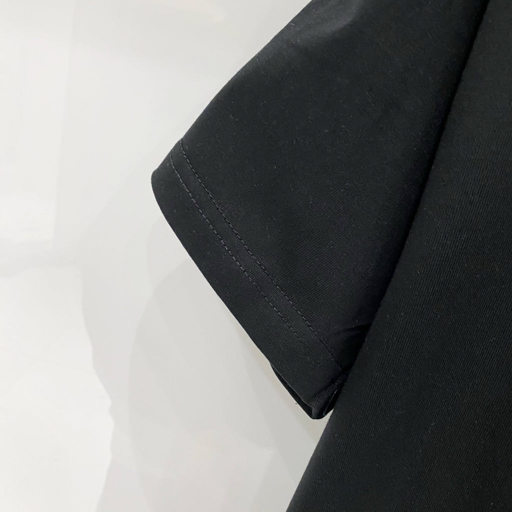 Black T-shirt sleeve cuff and stitched hem detail