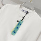 White T-shirt with crew neck and hanging retail tag near the collar