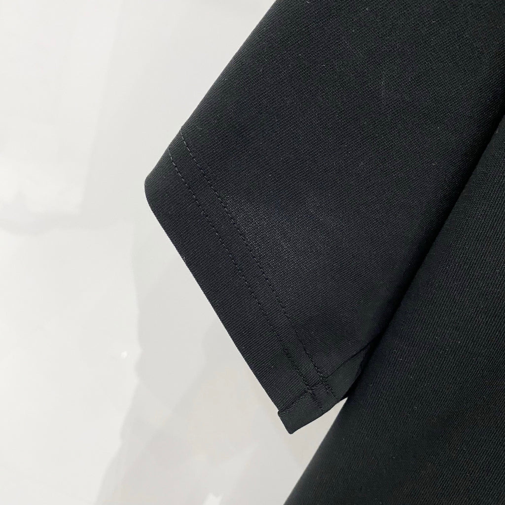 Black T-shirt sleeve hem with neat stitched edge