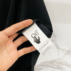 Black T-shirt with brand tag and small size label