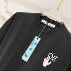 Black T-shirt with white Off-style hand logo and hanging label tag