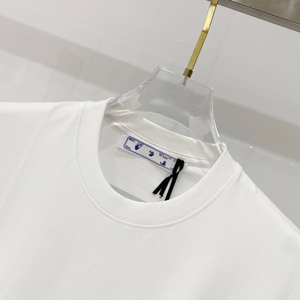 Off-white t-shirt neckline and collar seam, with small inner care label visible.