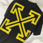 Black T-shirt with large yellow arrows and text graphic detail.