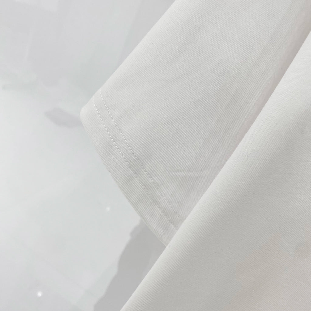Off-White T-shirt sleeve and hem detail in off-white