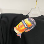 Off-White black T-shirt with colorful portrait graphic on chest, close-up