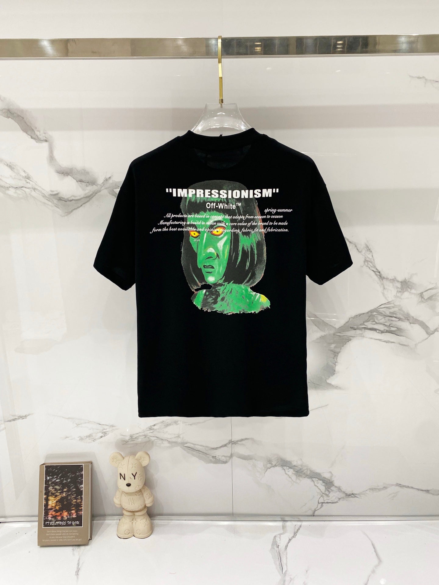 Off-White black T-shirt with green face artwork and 'IMPRESSIONISM' text print