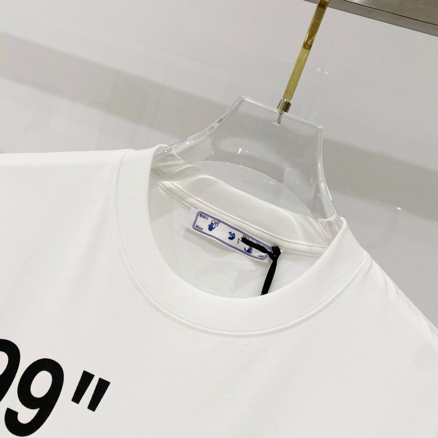 Off-white T-shirt neckline with inner care label