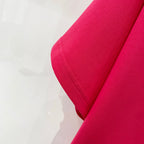 Off White red T-shirt sleeve close-up showing stitched seam and fabric texture.