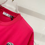 Off White red T-shirt close-up of neckline with inner tag and shoulder area.
