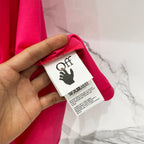Off White red T-shirt with care label detail near the collar.