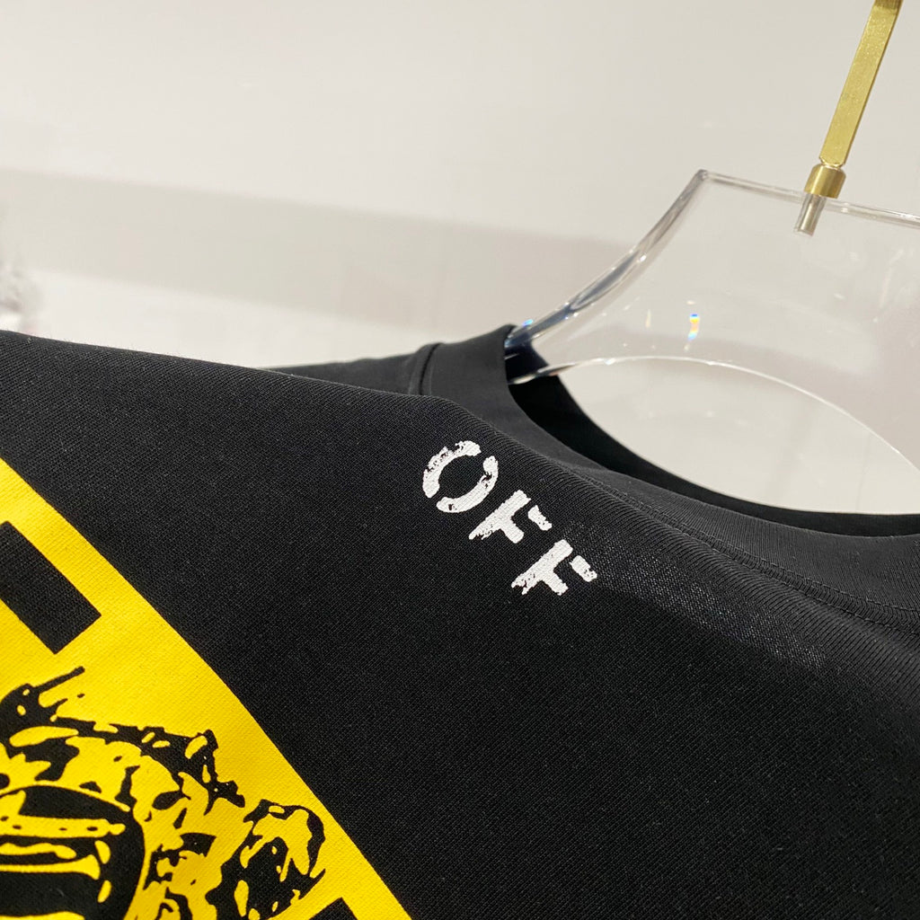 Off-White black T-shirt with small 'OFF' print near yellow graphic