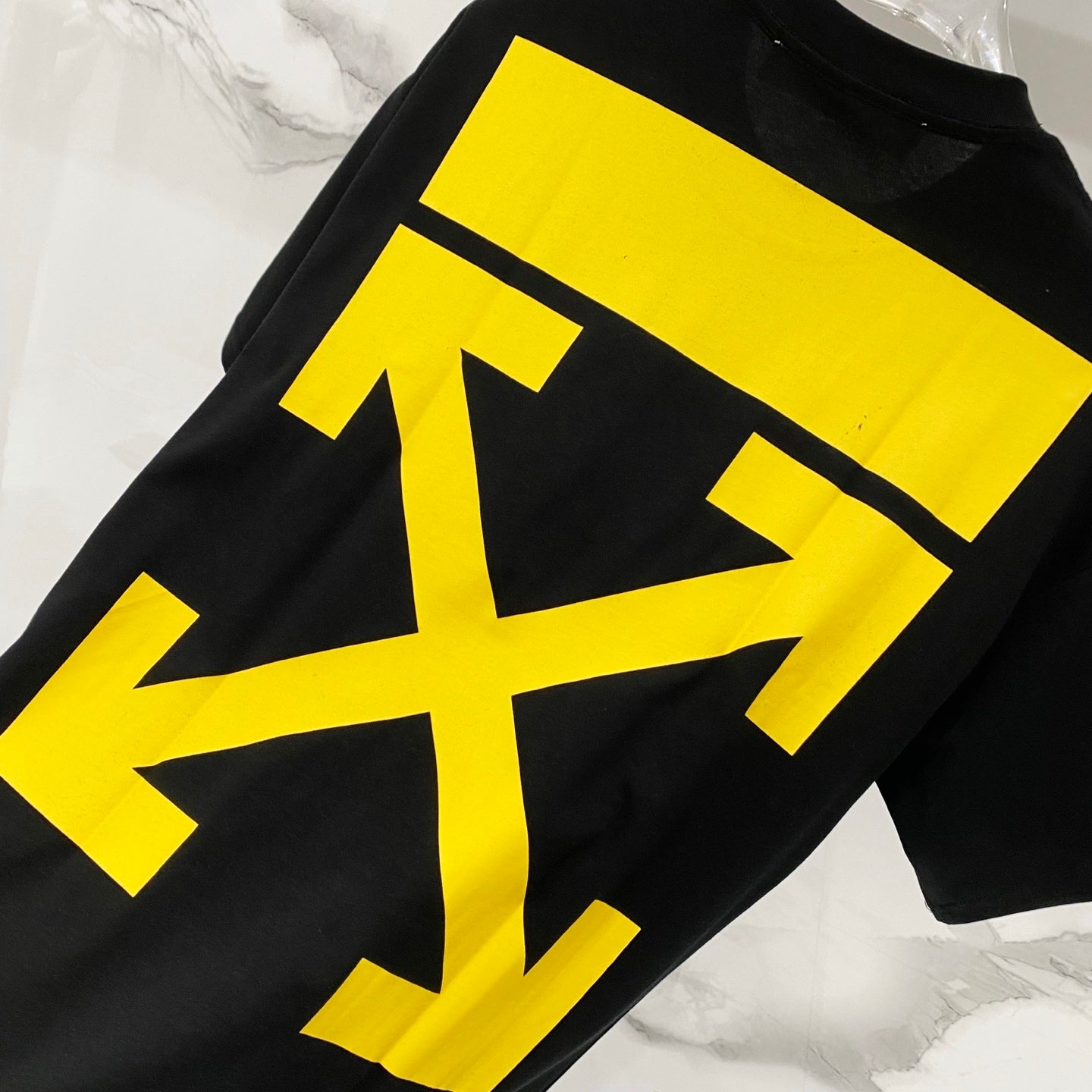 Off-White black T-shirt with large yellow diagonal logo graphic