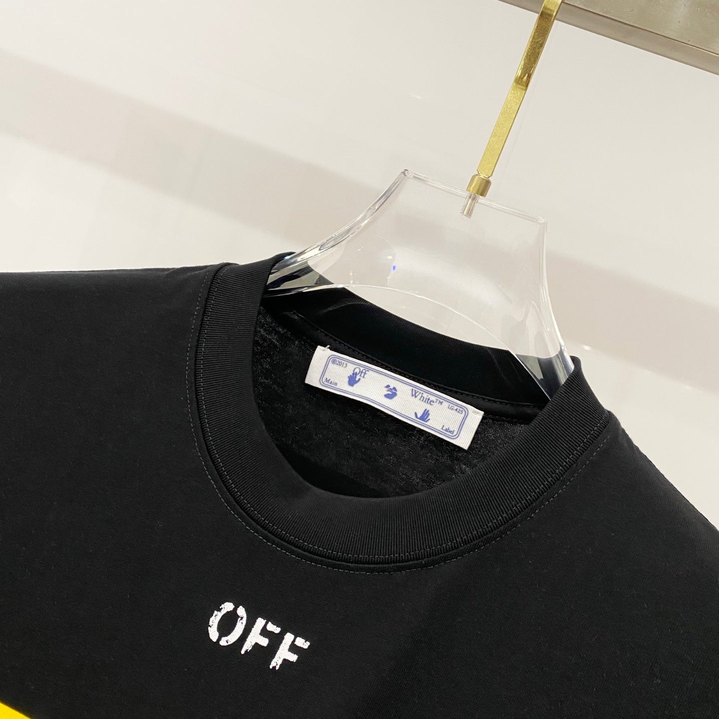 Off-White black crewneck T-shirt collar with small 'OFF' print