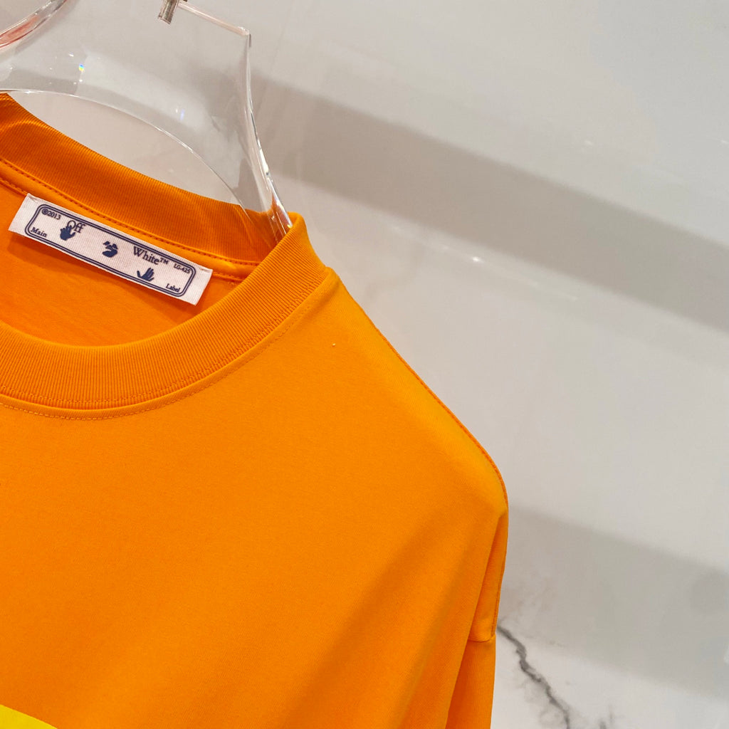 Orange T-shirt sleeve and crewneck, with neck label on hanger
