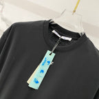 Off-White T-shirt close-up, black crew neck with hang tag and OFF print