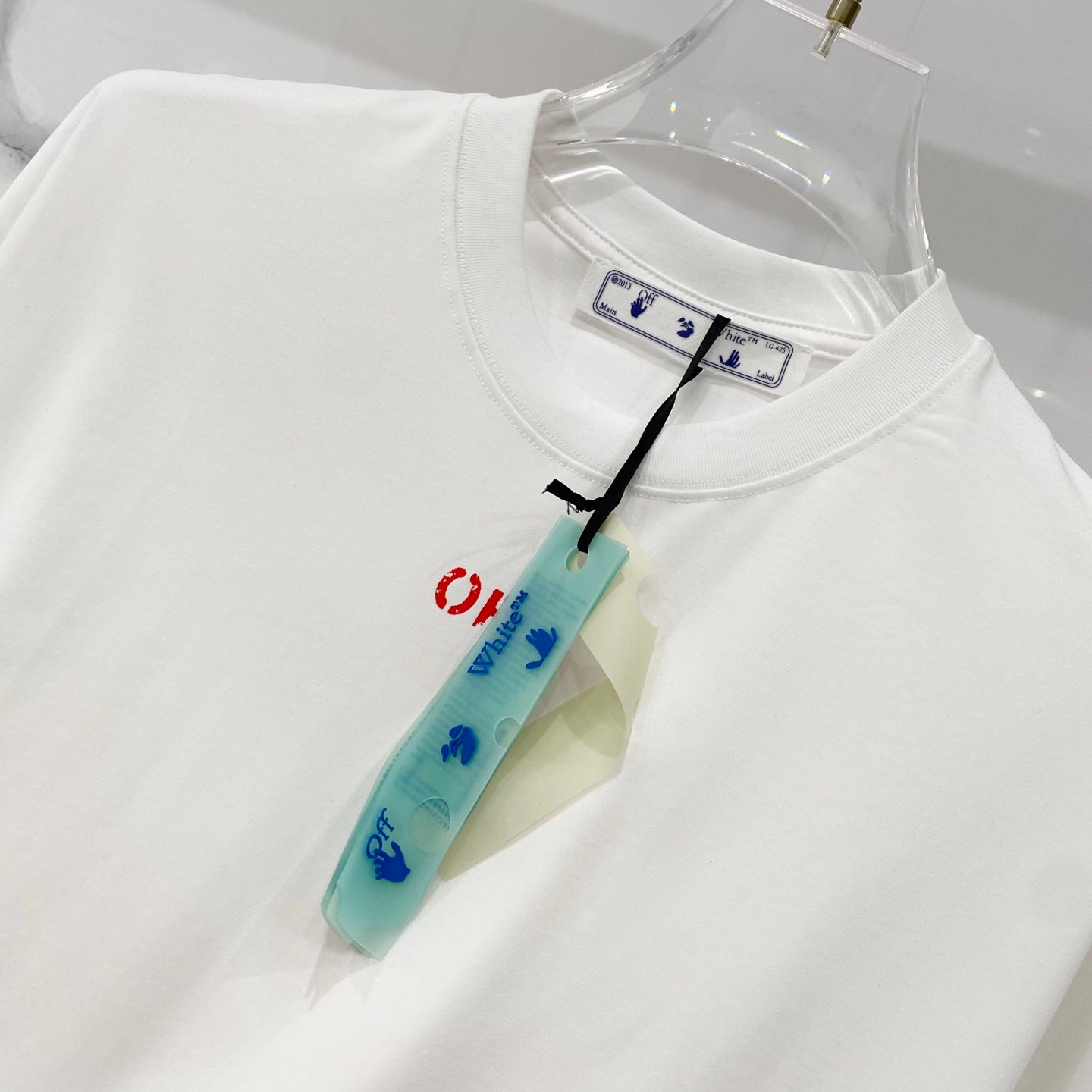 Off White off-white T-shirt with crew neck and red 'OFF' logo, hanging tag