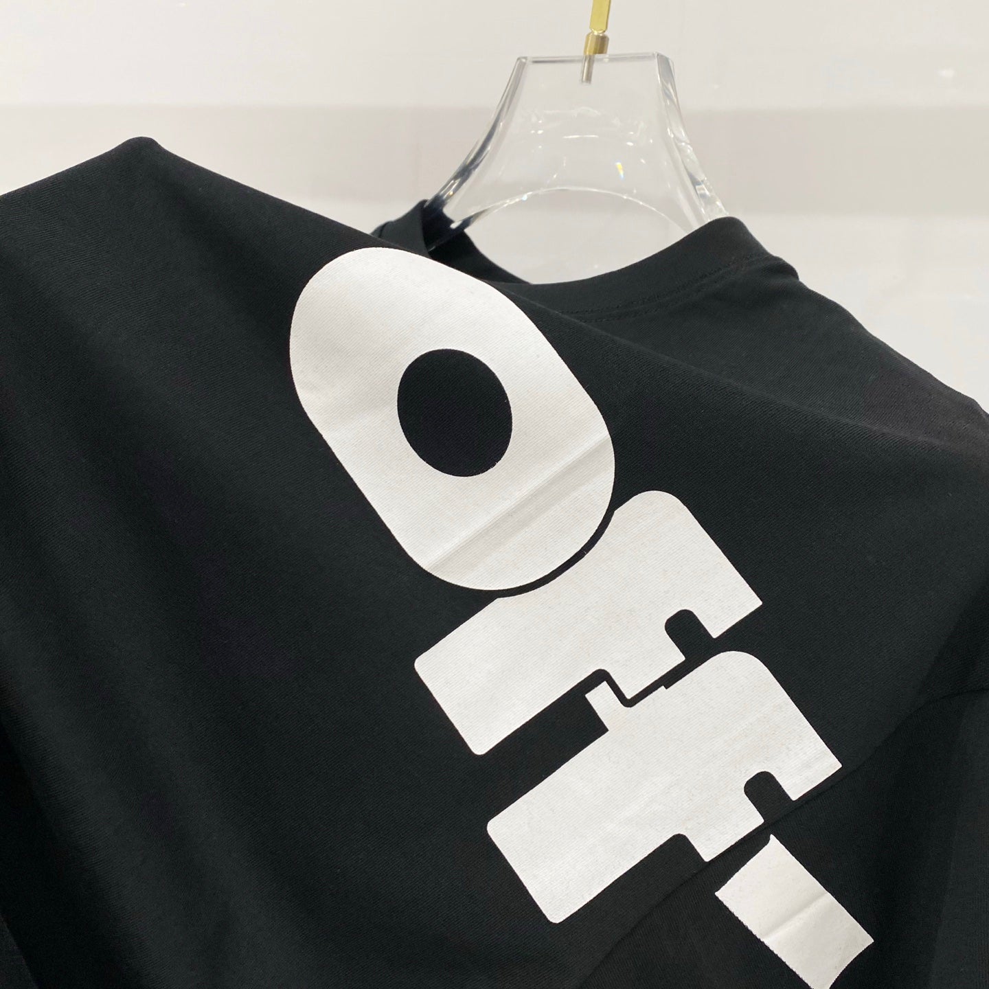 Off White T-shirt, black, oversized front logo close-up