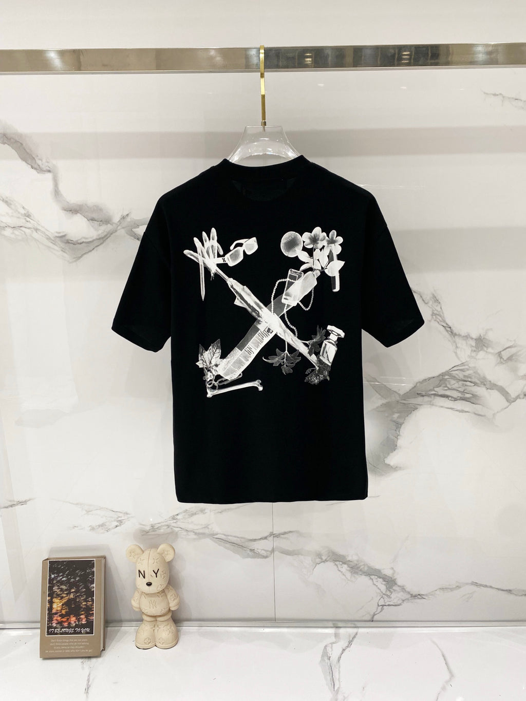 Black graphic T-shirt with large front skeleton-style floral print