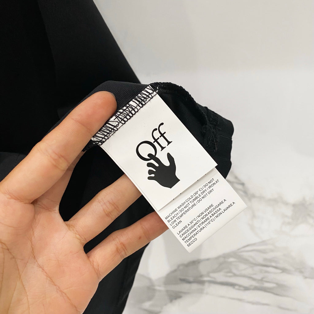 Black T-shirt with size/brand label attached