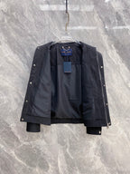 Louis Vuitton long jacket open to show interior lining and monogram panels