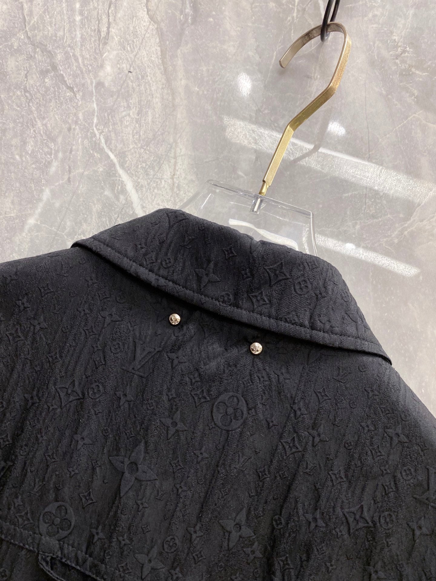 Louis Vuitton long jacket shoulder with embossed monogram texture and snap buttons