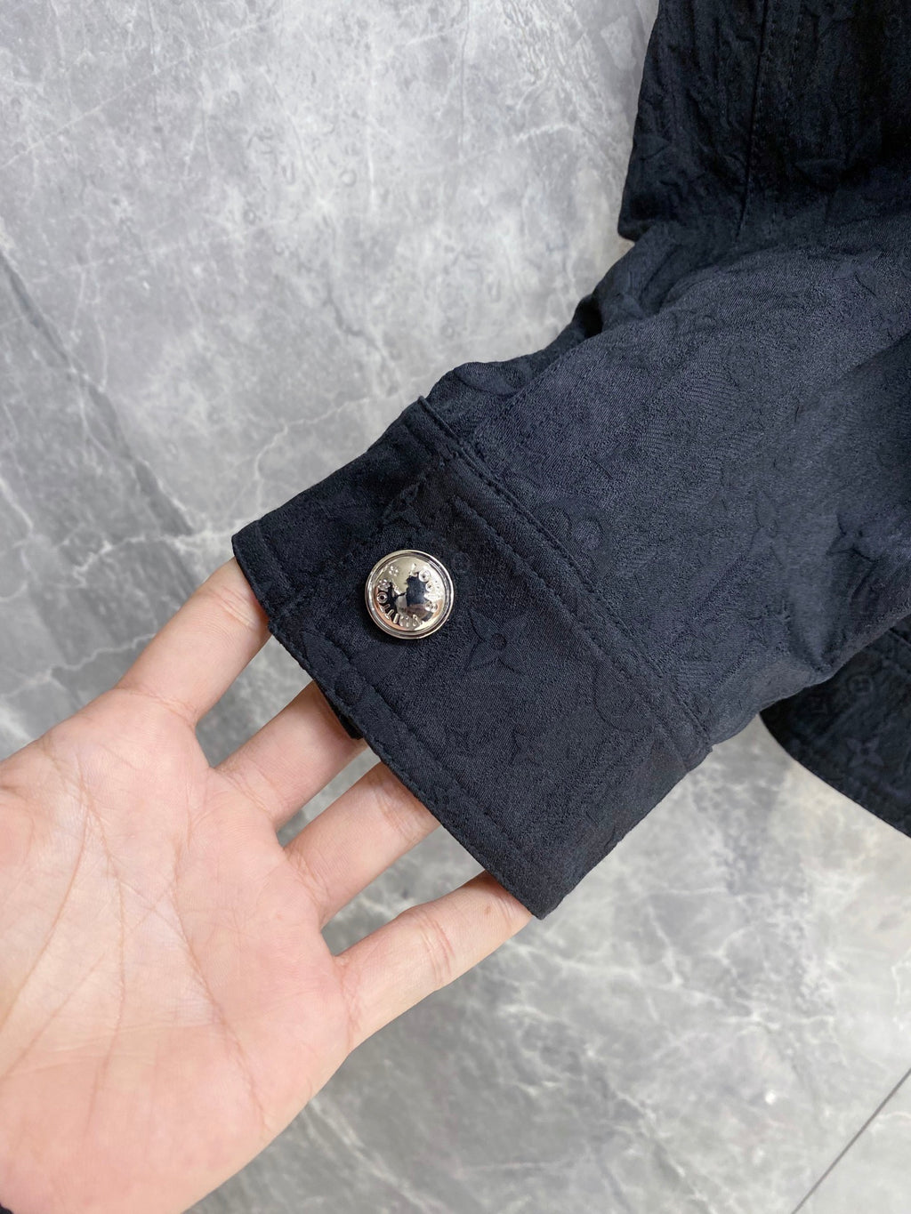 Louis Vuitton long jacket sleeve with gold snap and round button detail