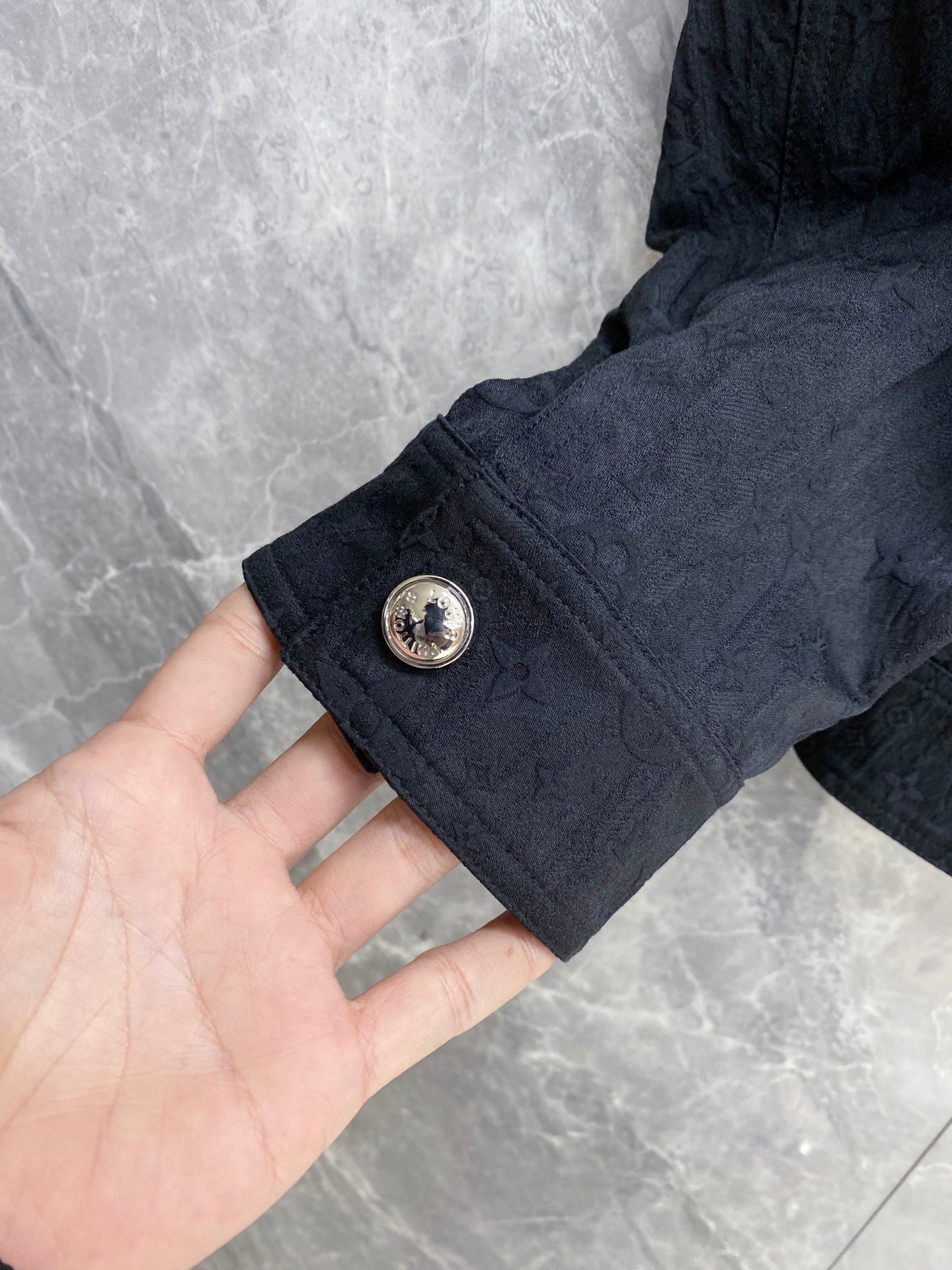 Louis Vuitton long jacket sleeve with gold snap and round button detail
