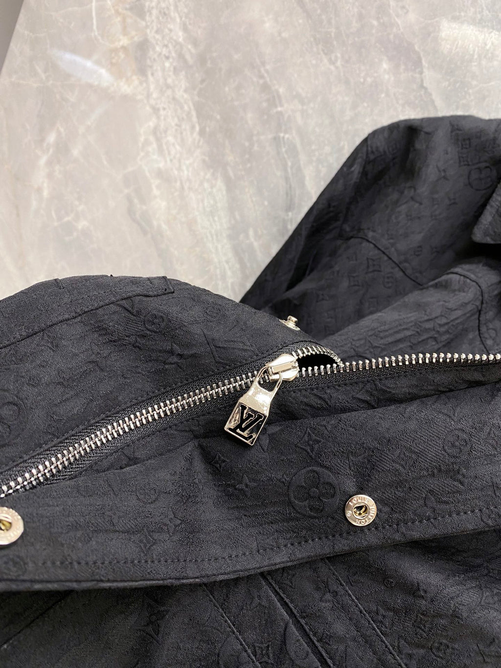 Louis Vuitton long jacket front with zip pull, snap buttons, and monogram texture