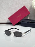 Cartier sunglasses with dark lenses and gold metal arms, round frame front view