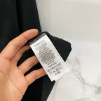 Burberry black T-shirt care and size label inside collar with printed text.