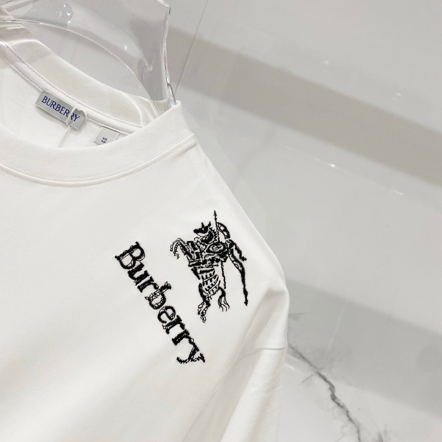 White Burberry T-shirt right chest graphic with horse logo and Burberry lettering