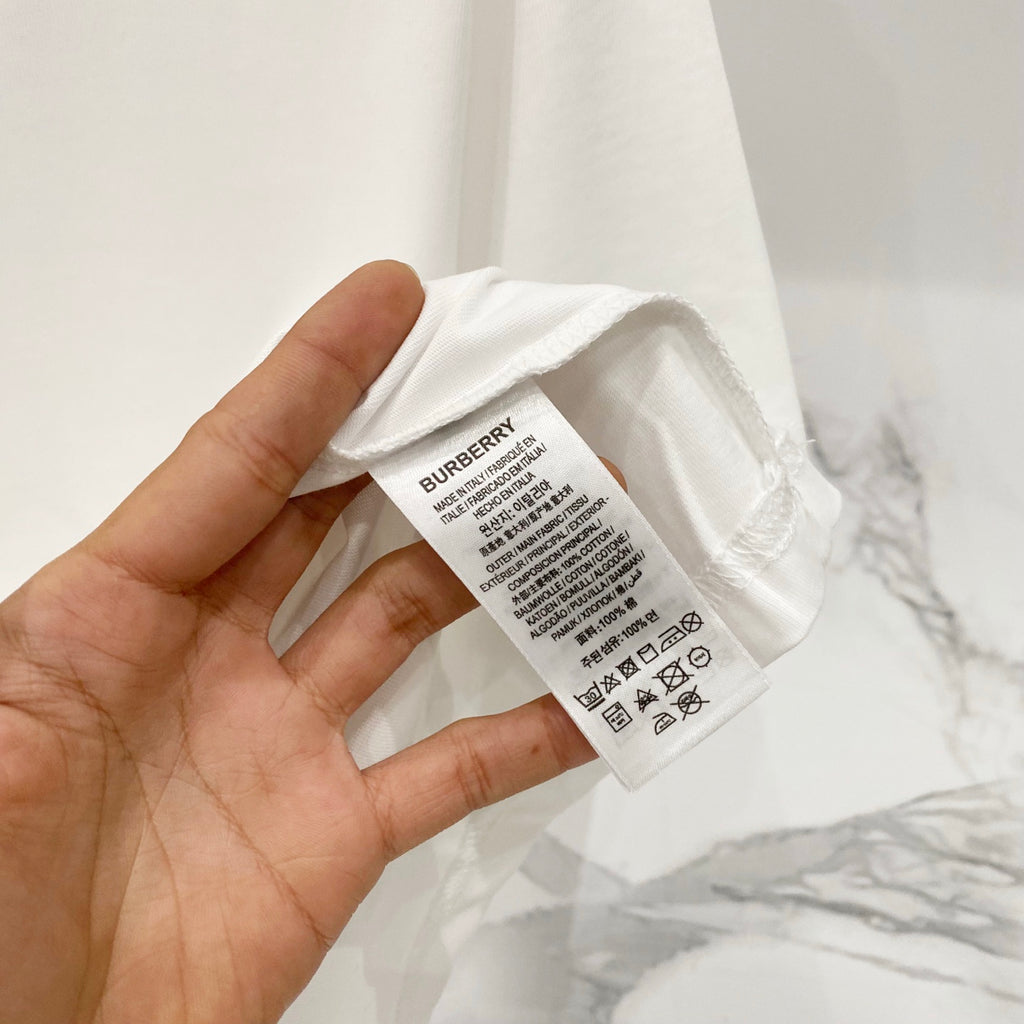 White Burberry T-shirt care label inside neck