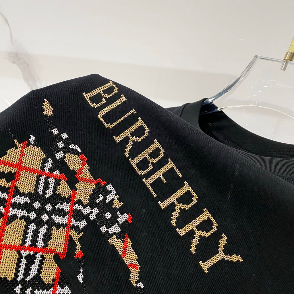 Black short-sleeve T-shirt with Burberry gold lettering detail
