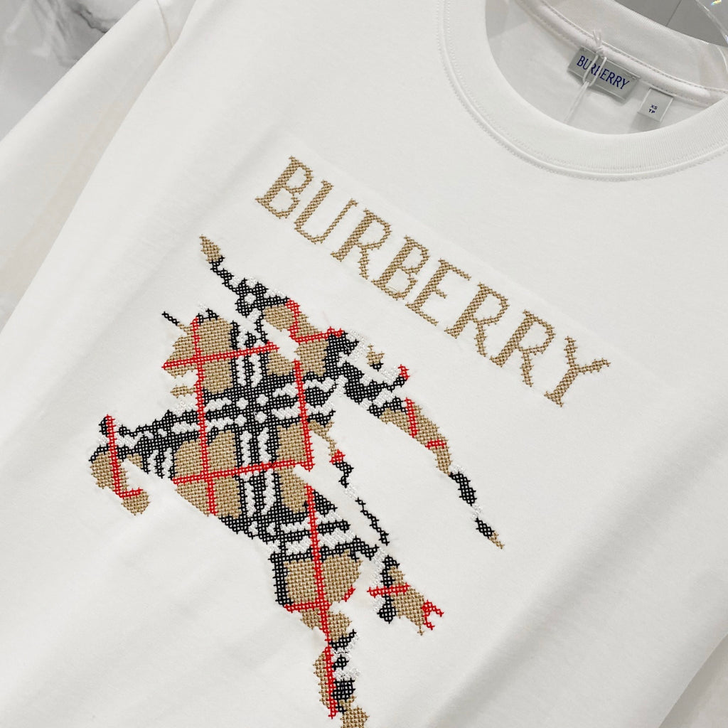 White Burberry T-shirt with gold logo text and multicolor horse graphic