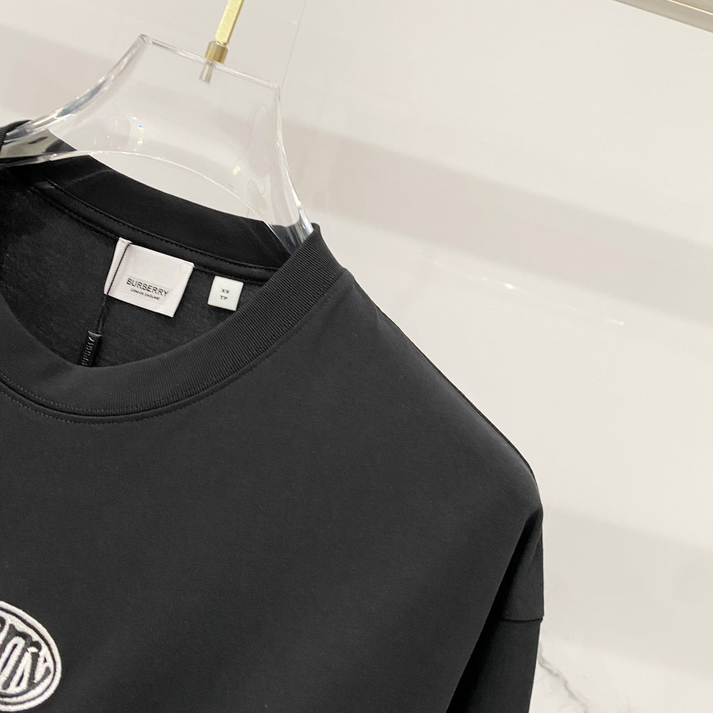 Black crewneck T-shirt with stitched collar and inner neck labels