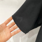Black short-sleeve T-shirt cuff and sleeve seam close-up