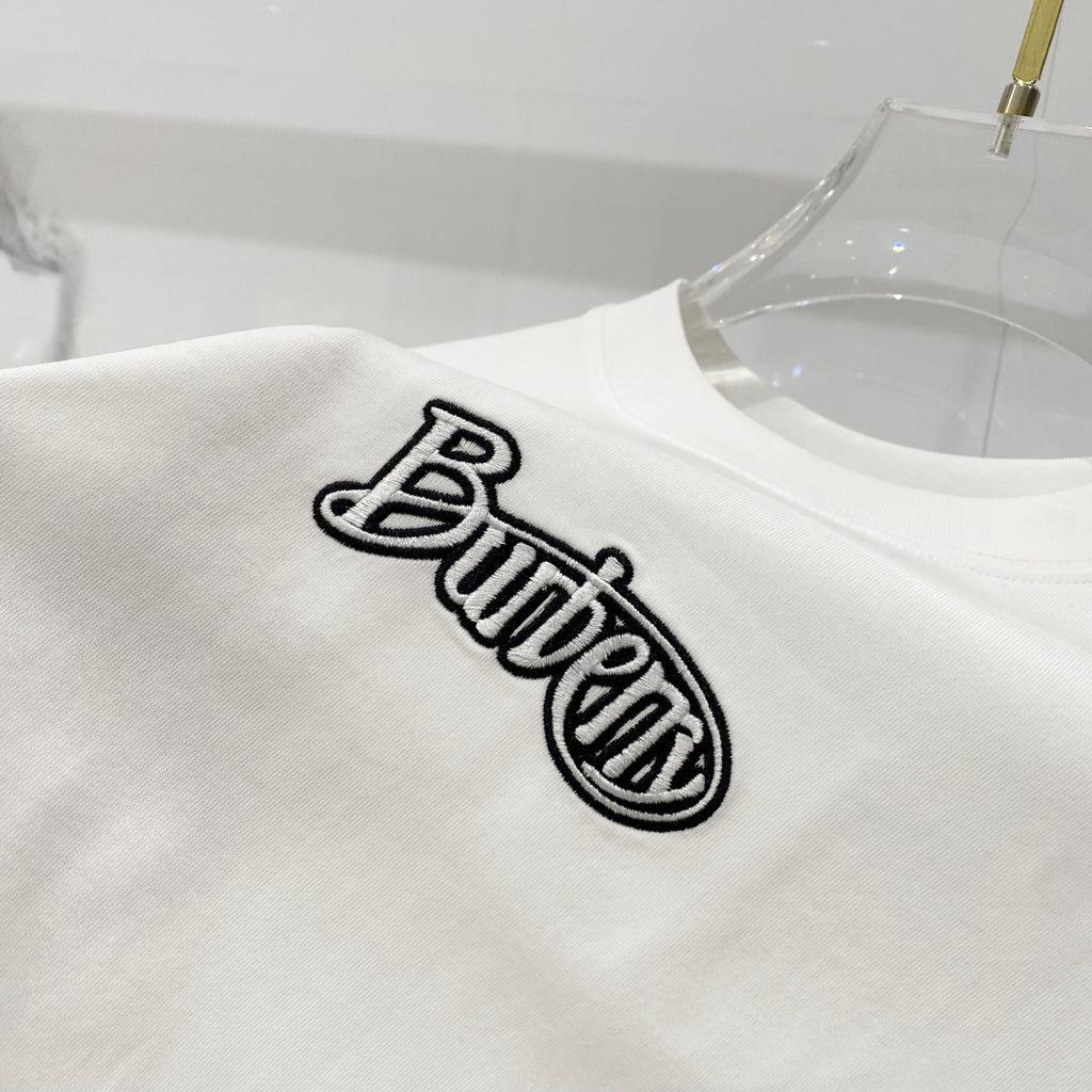 White short-sleeve T-shirt with embroidered-style black “Butter” logo on chest