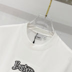White short-sleeve T-shirt neckline with black “Butter” graphic logo patch