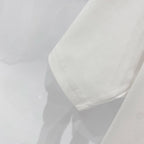 White short-sleeve T-shirt fabric texture and side seam/hem detail