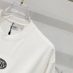 White short-sleeve T-shirt on hanger with interior neck label visible