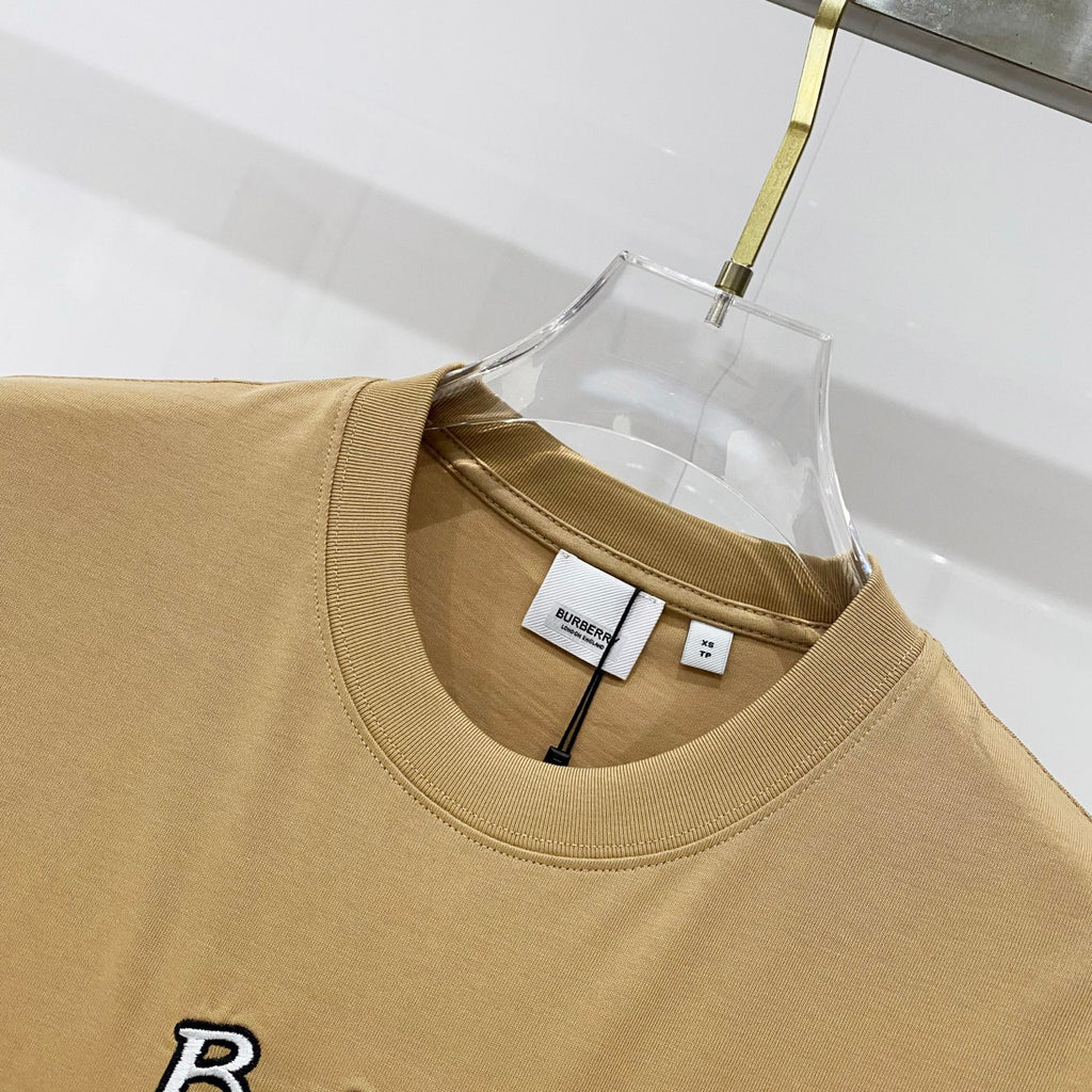 Tan crewneck T-shirt neckline with interior brand label and size tag