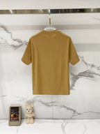 Tan short-sleeve T-shirt back view on a hanger