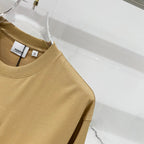 Tan short-sleeve T-shirt with round neckline and hang tags