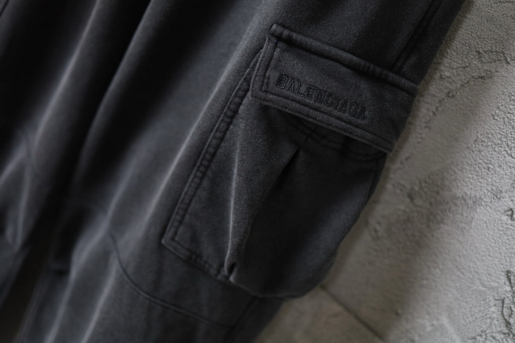 Dark gray cargo pants with Balenciaga label on pocket