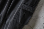 Dark gray cargo pants with Balenciaga label on pocket