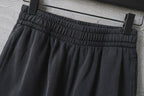 Dark gray cargo pants waistband with elastic gathers