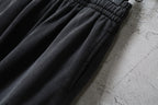 Dark gray cargo pants with elastic waistband and straight legs