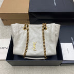 White quilted leather tote bag with gold chain straps and YSL logo front
