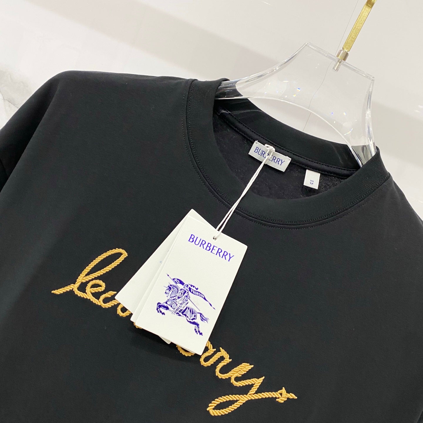 Black crewneck T-shirt with Burberry tag and gold script logo