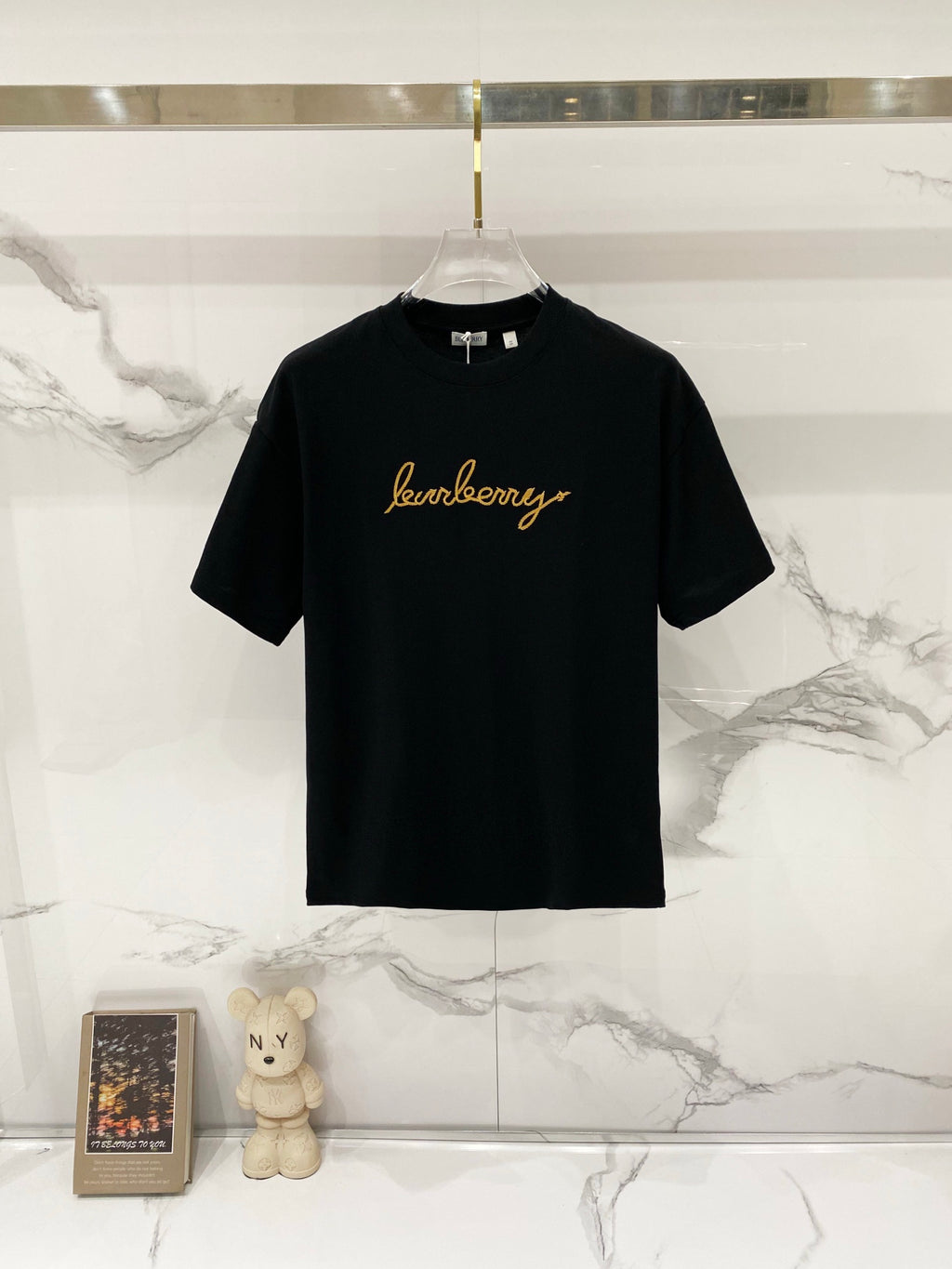 Black Burberry T-shirt with gold scripted logo on chest